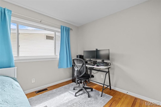 190 Coteau Ln, Florissant, MO 63033 - office area with baseboards and wood finished floors