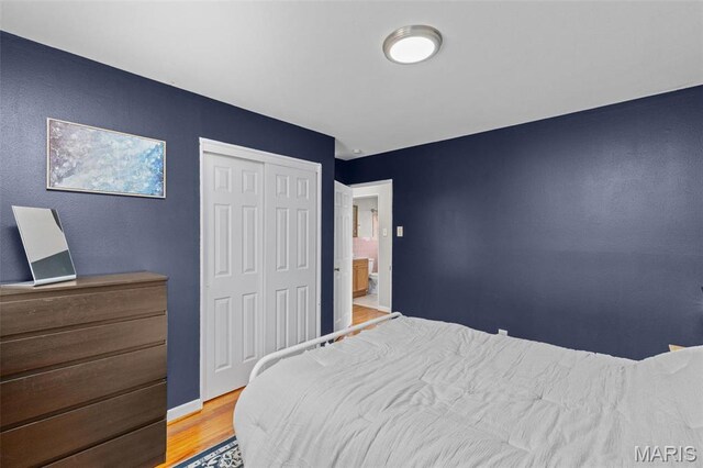 190 Coteau Ln, Florissant, MO 63033 - bedroom with wood finished floors, a closet, and baseboards