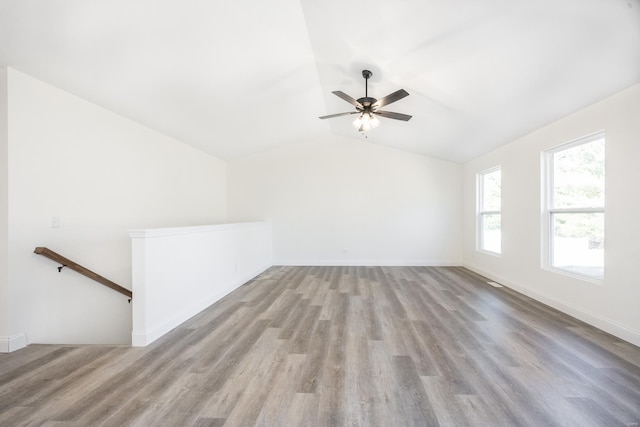 7349 Providence, Edwardsville, IL 62025 - unfurnished living room featuring wood finished floors, lofted ceiling, a ceiling fan, and baseboards