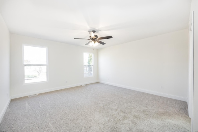 7349 Providence, Edwardsville, IL 62025 - spare room featuring light carpet, baseboards, and a ceiling fan