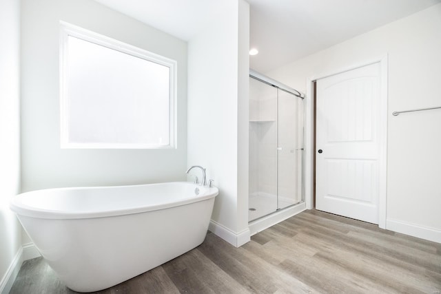 7349 Providence, Edwardsville, IL 62025 - full bathroom featuring baseboards, wood finished floors, a shower stall, and a soaking tub