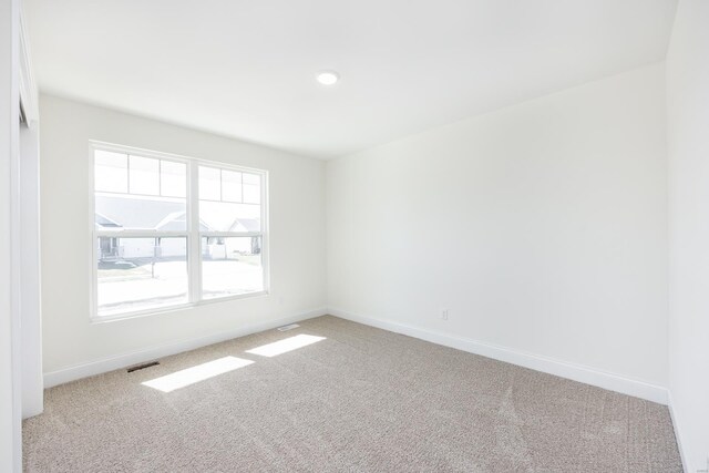 7349 Providence, Edwardsville, IL 62025 - unfurnished room with light colored carpet, baseboards, and recessed lighting