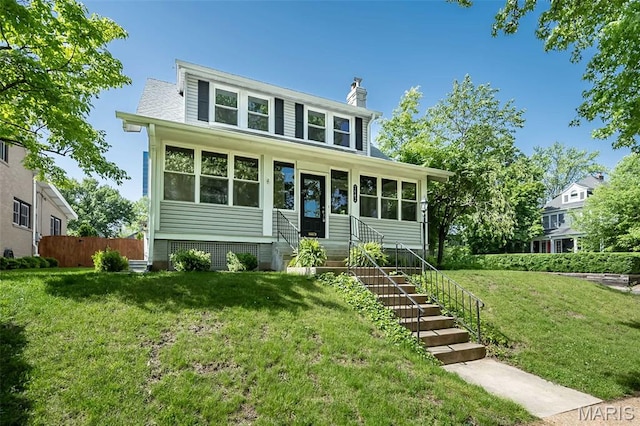 7642 Westmoreland Ave, Saint Louis, MO 63105 - view of front of property with a chimney and entry steps