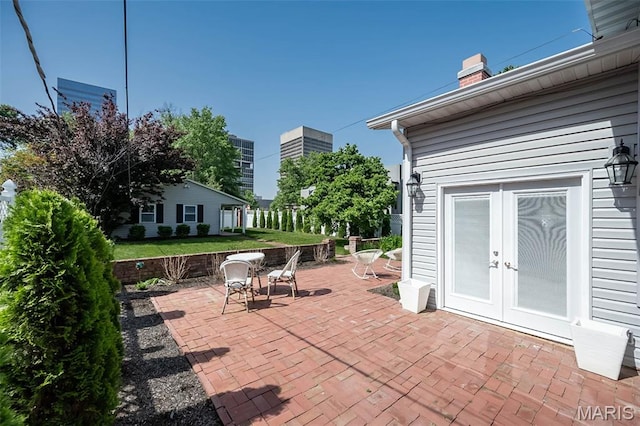 7642 Westmoreland Ave, Saint Louis, MO 63105 - view of patio / terrace with french doors