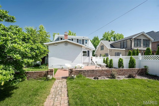 7642 Westmoreland Ave, Saint Louis, MO 63105 - back of house featuring a chimney