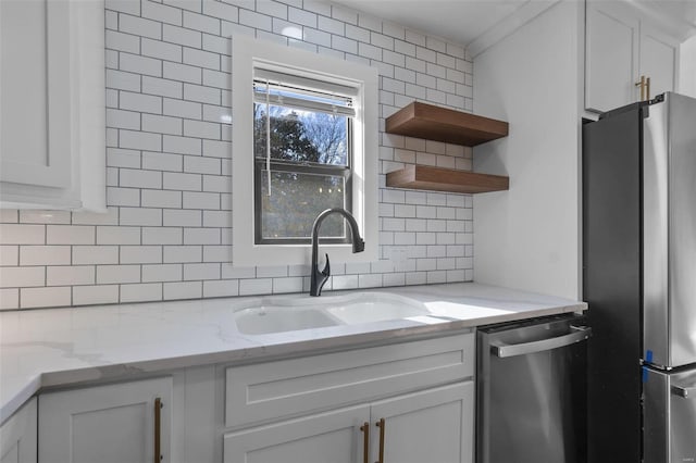 470 Saint Paul Dr, New Madrid, MO 63869 - kitchen featuring appliances with stainless steel finishes, a sink, backsplash, open shelves, and white cabinetry
