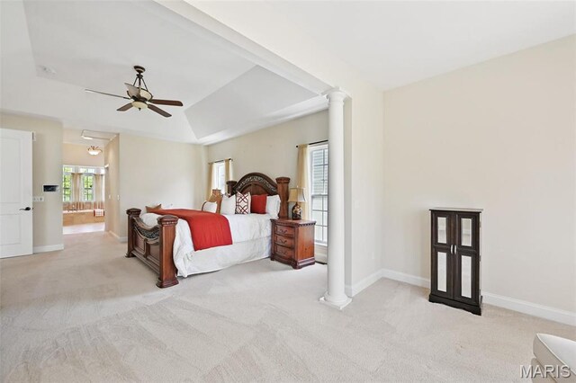 bedroom with carpet floors, baseboards, ceiling fan, decorative columns, and lofted ceiling