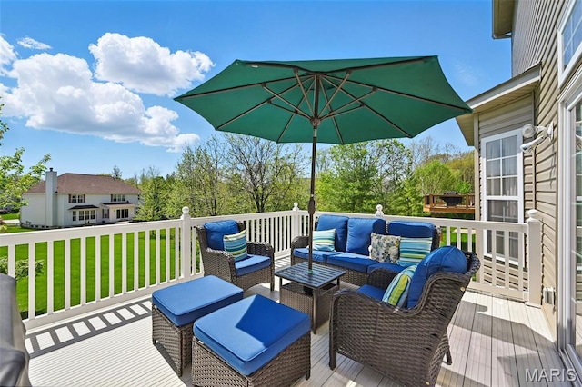 wooden terrace featuring an outdoor living space and a lawn
