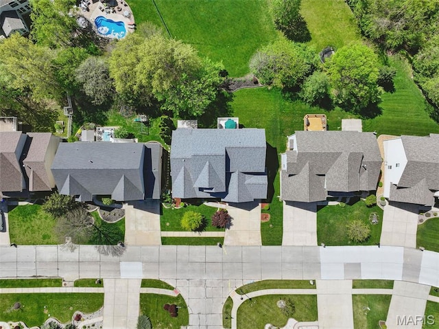aerial perspective of suburban area featuring a pool area