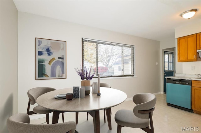 1235 Flicker Dr, Florissant, MO 63031 - dining room featuring light tile patterned floors and baseboards