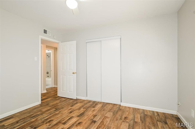 1235 Flicker Dr, Florissant, MO 63031 - unfurnished bedroom featuring wood finished floors and a closet