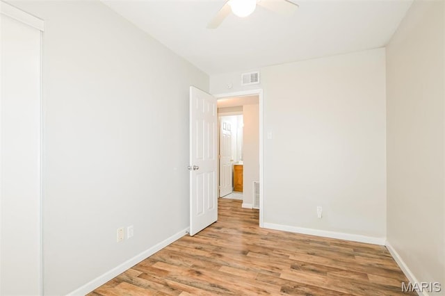 1235 Flicker Dr, Florissant, MO 63031 - empty room featuring wood finished floors and a ceiling fan