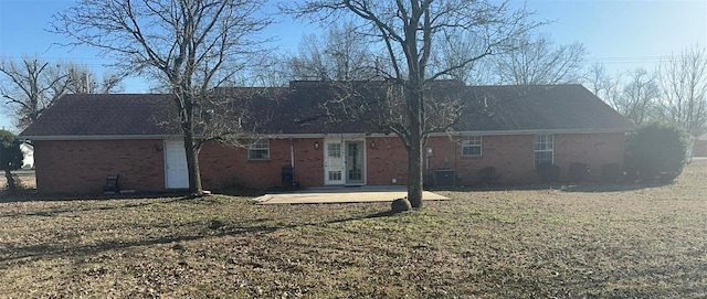 810 E Cedar St, Bertrand, MO 63823 - back of property with a patio area, brick siding, and a yard