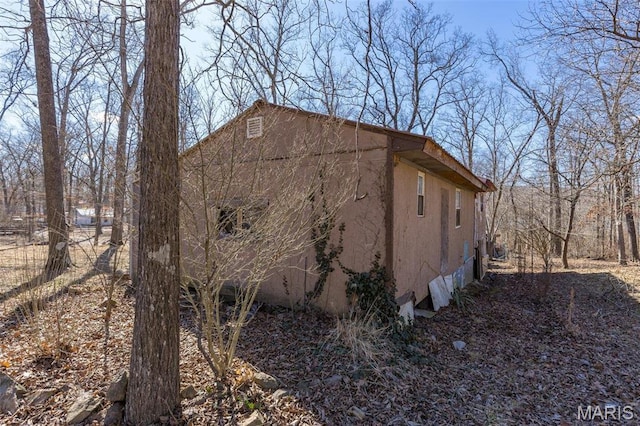 631 Columbia Dr, Bismarck, MO 63624 - view of side of property featuring stucco siding