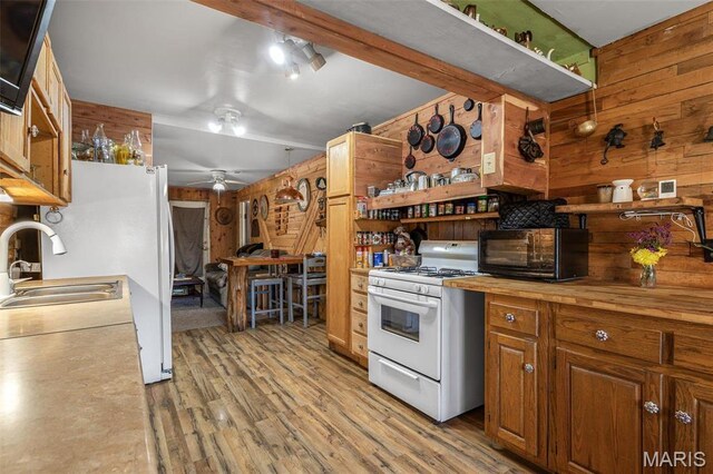 631 Columbia Dr, Bismarck, MO 63624 - kitchen featuring white appliances, wood walls, open shelves, wood counters, and a sink