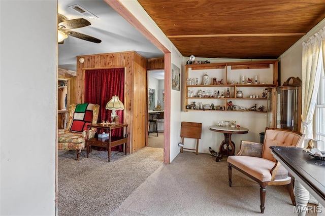 631 Columbia Dr, Bismarck, MO 63624 - living area with carpet flooring, wood walls, a ceiling fan, and wood ceiling