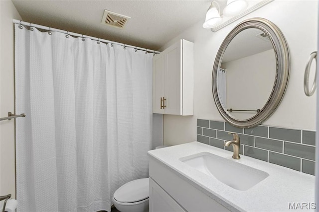 1773 High School Dr, Brentwood, MO 63144 - bathroom with tasteful backsplash, toilet, and vanity