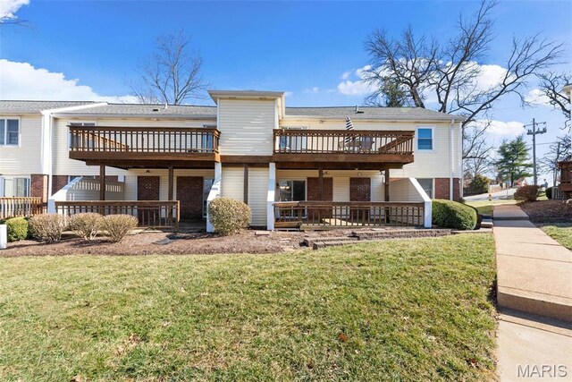 1773 High School Dr, Brentwood, MO 63144 - back of property featuring brick siding, a deck, a yard, and a patio