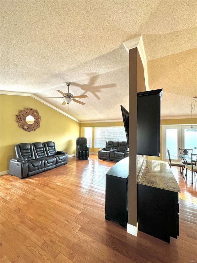 5284 Summer Cir, Imperial, MO 63052 - living room featuring a textured ceiling, crown molding, vaulted ceiling, ceiling fan, and wood finished floors