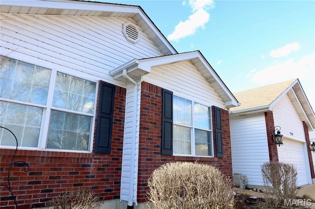 5284 Summer Cir, Imperial, MO 63052 - view of property exterior featuring a garage and brick siding