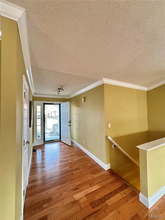5284 Summer Cir, Imperial, MO 63052 - unfurnished room featuring a textured ceiling, wood finished floors, ornamental molding, and baseboards