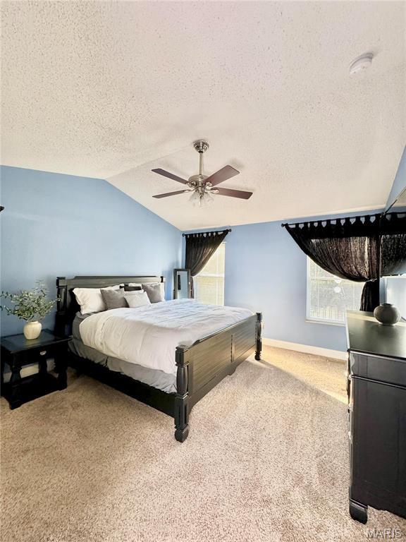 5284 Summer Cir, Imperial, MO 63052 - bedroom featuring carpet floors, a textured ceiling, lofted ceiling, a ceiling fan, and baseboards