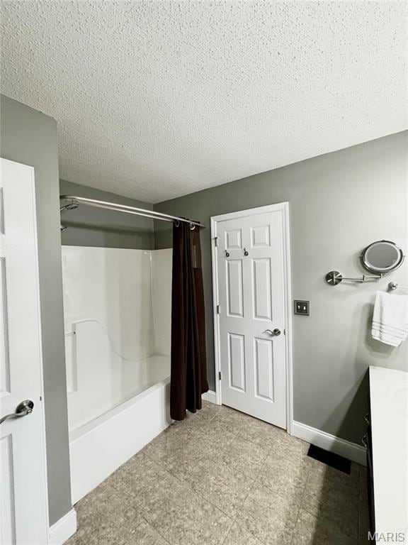 5284 Summer Cir, Imperial, MO 63052 - full bathroom with baseboards, a textured ceiling, vanity, and shower / bath combination with curtain