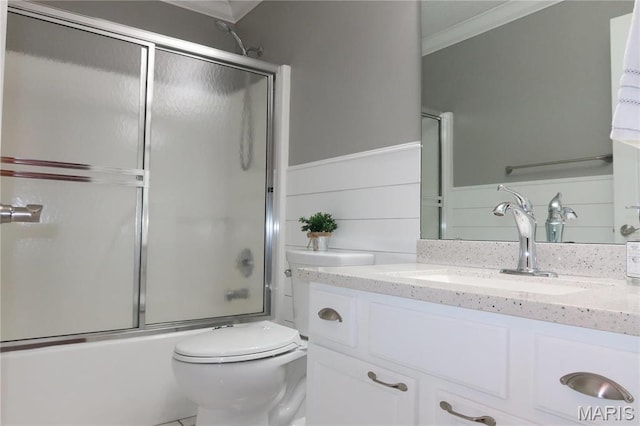 5284 Summer Cir, Imperial, MO 63052 - full bath featuring ornamental molding, vanity, toilet, shower / bath combination with glass door, and a wainscoted wall
