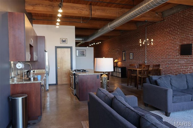 1015 Washington Ave Unit 609, Saint Louis, MO 63101 - living area featuring brick wall, wooden ceiling, beamed ceiling, concrete floors, and a chandelier