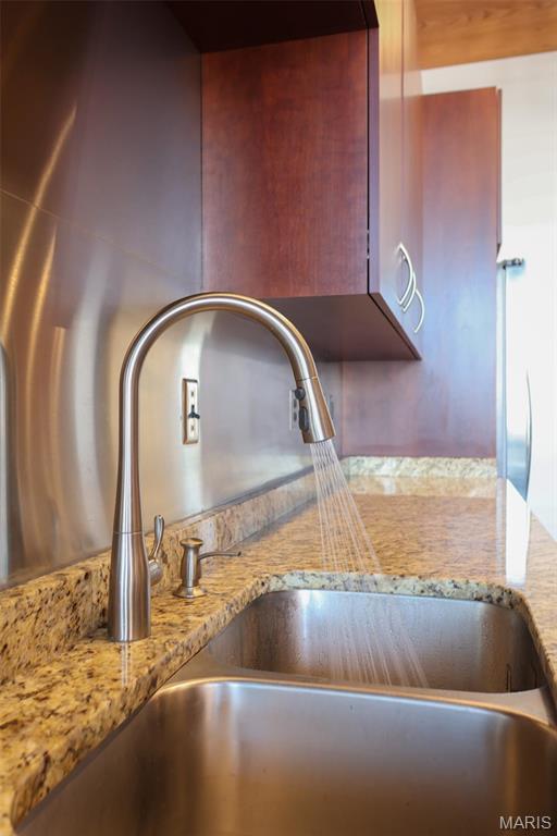 1015 Washington Ave Unit 609, Saint Louis, MO 63101 - kitchen view of a sink and light stone counters