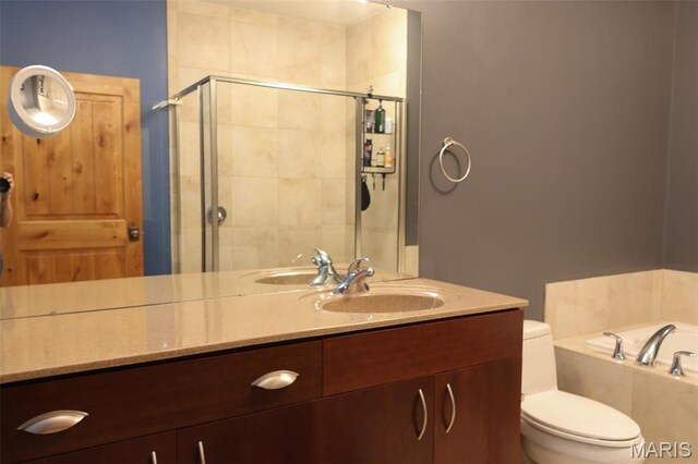 1015 Washington Ave Unit 609, Saint Louis, MO 63101 - bathroom featuring a shower stall, toilet, a garden tub, and vanity