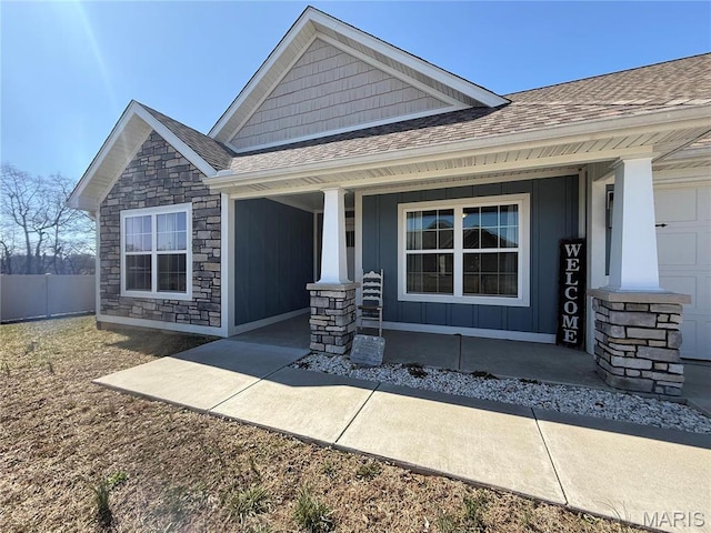 379 Lakeview Cpe, Girardeau, MO 63701 - view of front of property with a porch, roof with shingles, stone siding, and board and batten siding