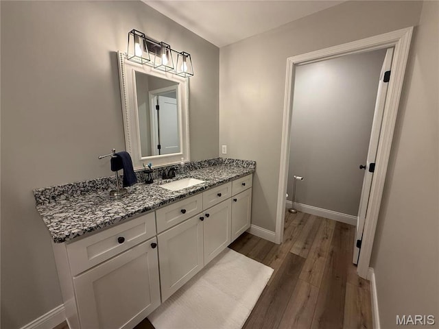 379 Lakeview Cpe, Girardeau, MO 63701 - bathroom featuring wood finished floors, vanity, and baseboards