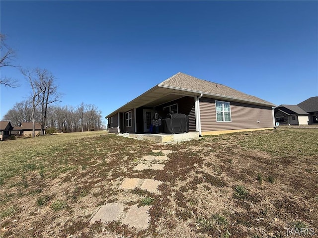 379 Lakeview Cpe, Girardeau, MO 63701 - view of property exterior with a lawn and a shingled roof