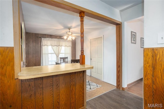 4 New Sugar Creek Rd, Fenton, MO 63026 - kitchen featuring a ceiling fan, wood finished floors, and wood walls