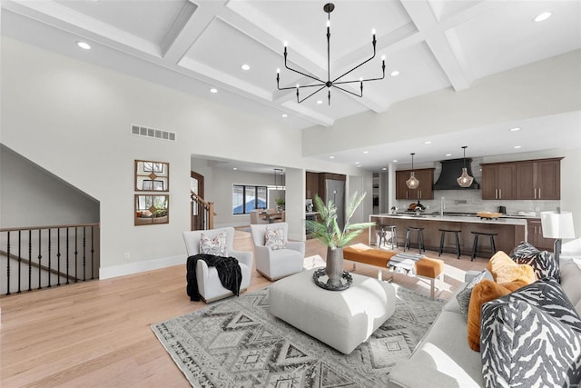 16908 Lewis Spring Farms Rd, Wildwood, MO 63005 - living area featuring light wood-type flooring, beam ceiling, a chandelier, recessed lighting, and coffered ceiling