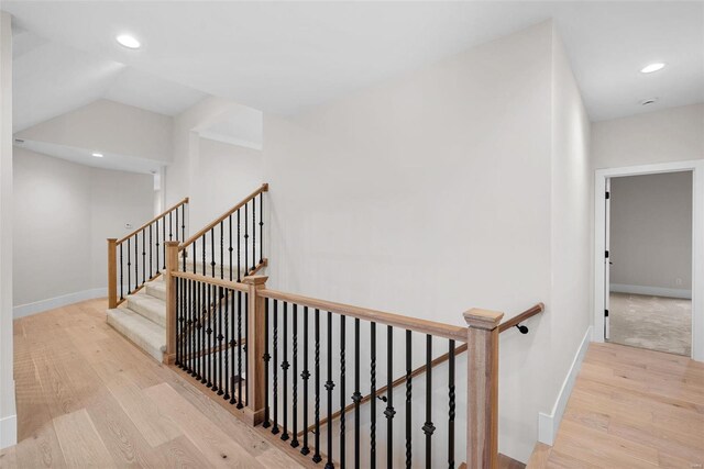 16908 Lewis Spring Farms Rd, Wildwood, MO 63005 - staircase with wood finished floors, baseboards, recessed lighting, and vaulted ceiling