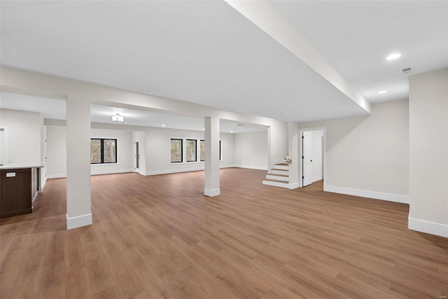 16908 Lewis Spring Farms Rd, Wildwood, MO 63005 - below grade area featuring baseboards, light wood-style floors, stairs, and recessed lighting