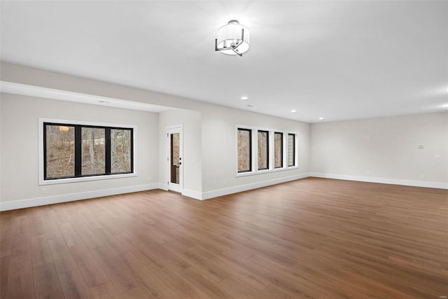 16908 Lewis Spring Farms Rd, Wildwood, MO 63005 - unfurnished living room featuring healthy amount of natural light, baseboards, and recessed lighting