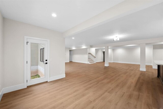 16908 Lewis Spring Farms Rd, Wildwood, MO 63005 - finished basement featuring stairs, light wood-style flooring, baseboards, and recessed lighting