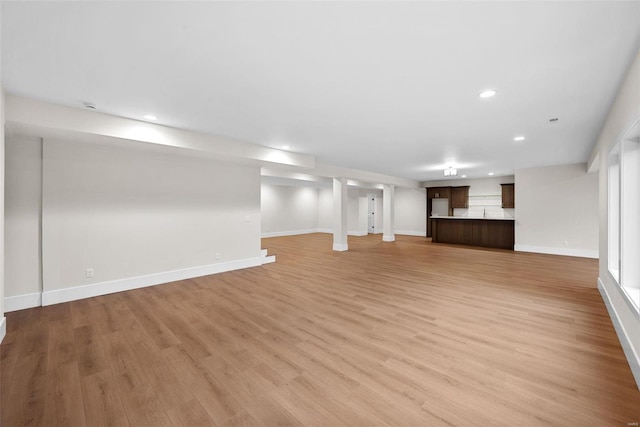 16908 Lewis Spring Farms Rd, Wildwood, MO 63005 - unfurnished living room featuring baseboards, recessed lighting, and light wood-style floors
