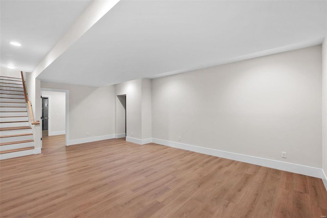 16908 Lewis Spring Farms Rd, Wildwood, MO 63005 - unfurnished living room featuring baseboards, light wood-type flooring, stairway, and recessed lighting