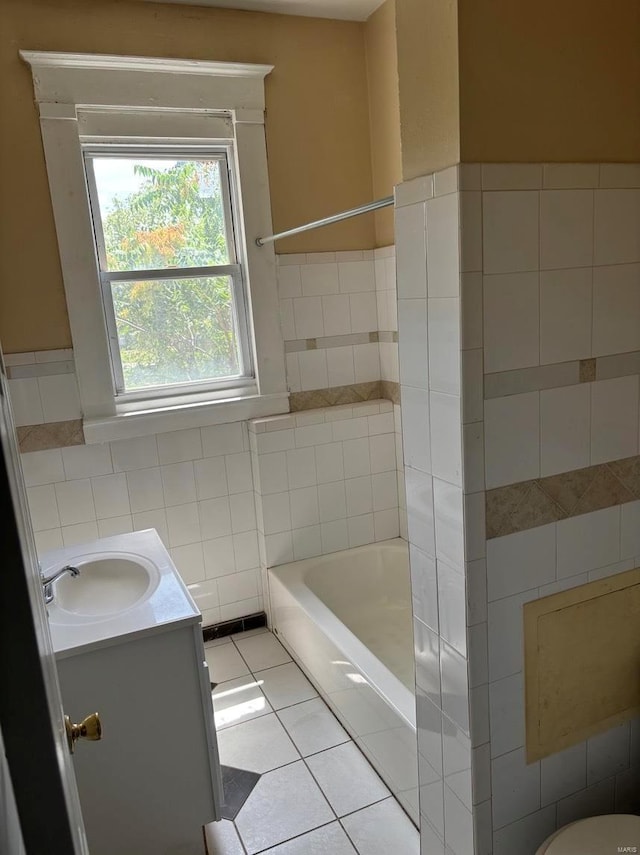 4172 Delmar Blvd, Saint Louis, MO 63108 - full bath featuring tile walls, tile patterned floors, vanity, and wainscoting