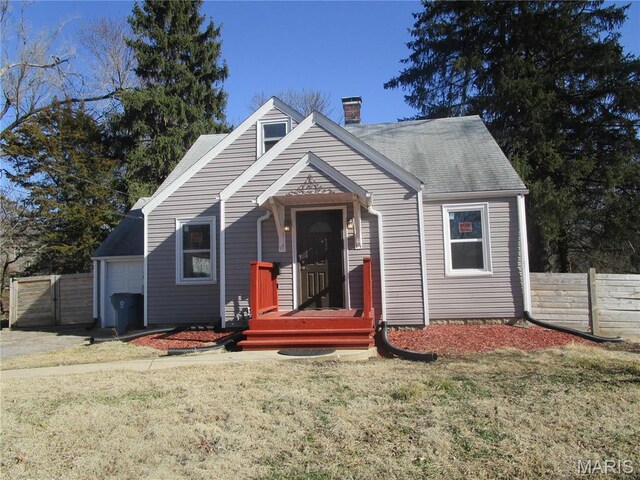 7 Pineview Ln, Collinsville, IL 62234 - view of front facade with a chimney and a shingled roof