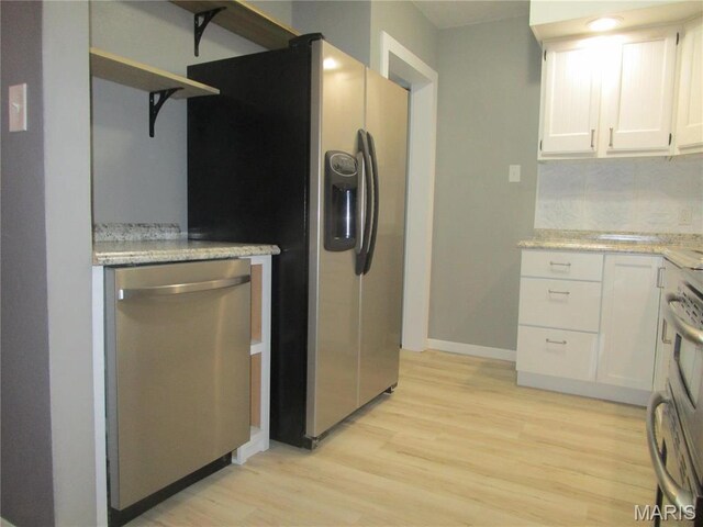 7 Pineview Ln, Collinsville, IL 62234 - kitchen featuring stainless steel appliances, open shelves, light wood-style flooring, white cabinets, and baseboards