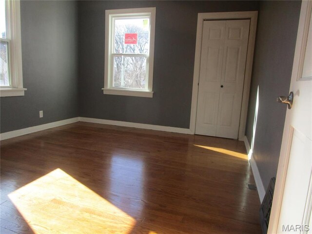 7 Pineview Ln, Collinsville, IL 62234 - empty room with wood finished floors and baseboards