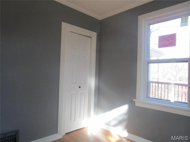 7 Pineview Ln, Collinsville, IL 62234 - spare room with ornamental molding, wood finished floors, and baseboards
