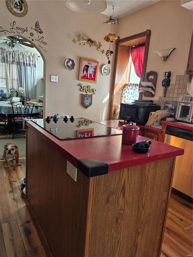 3019 Mockingbird Ln, Granite City, IL 62040 - kitchen with black microwave, dishwasher, wood finished floors, and a kitchen island