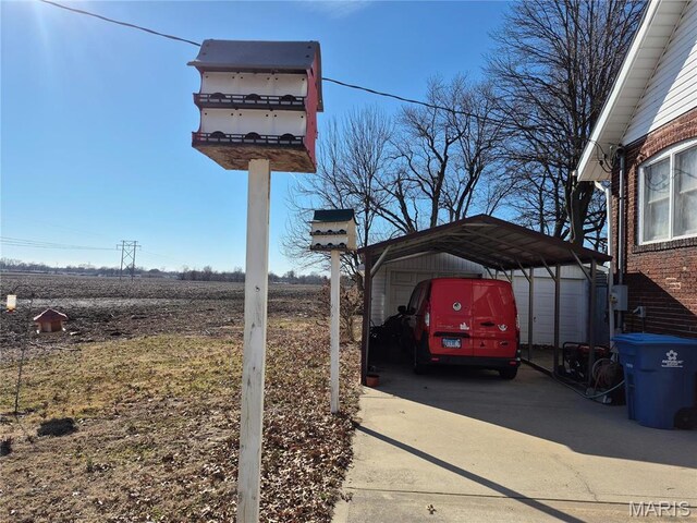 3019 Mockingbird Ln, Granite City, IL 62040 - view of parking / parking lot featuring a carport and driveway