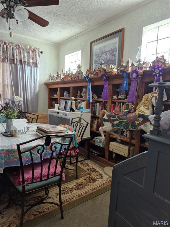 3019 Mockingbird Ln, Granite City, IL 62040 - dining area with a textured ceiling and a ceiling fan